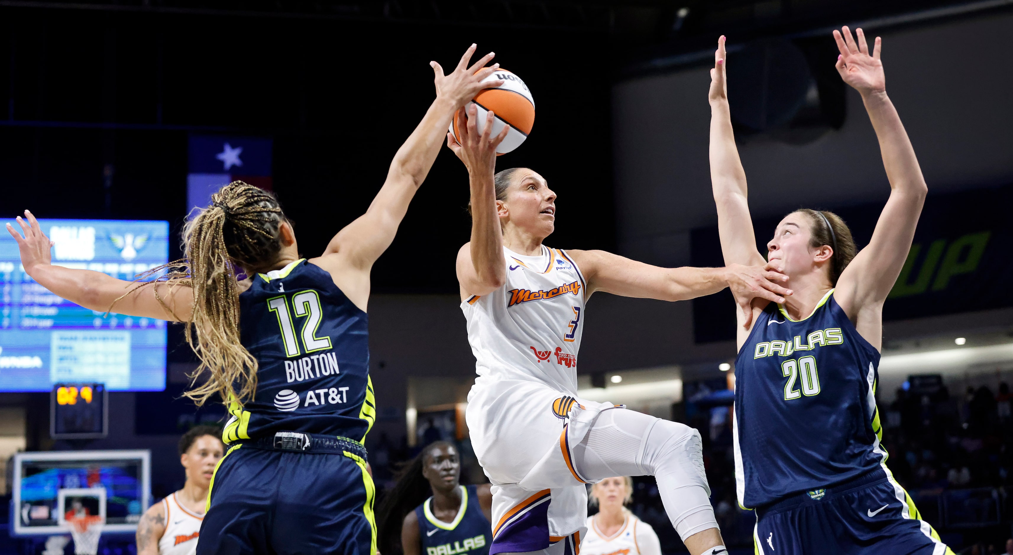 Phoenix Mercury guard Diana Taurasi (3) has her running lay up blocked by Dallas Wings guard...