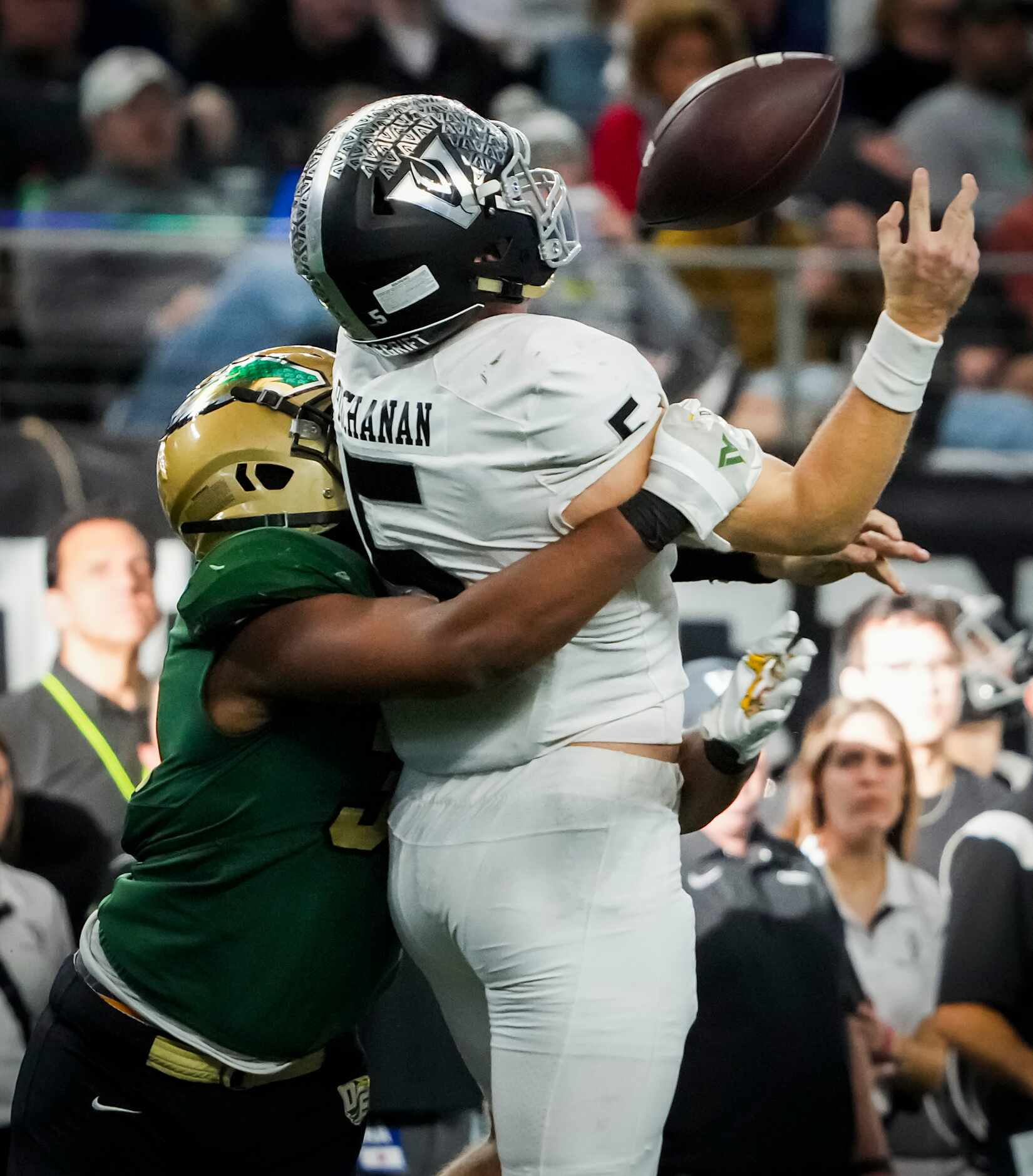 Austin Vandegrift quarterback Brayden Buchanan (5) fumbles as he is hit by DeSoto defensive...