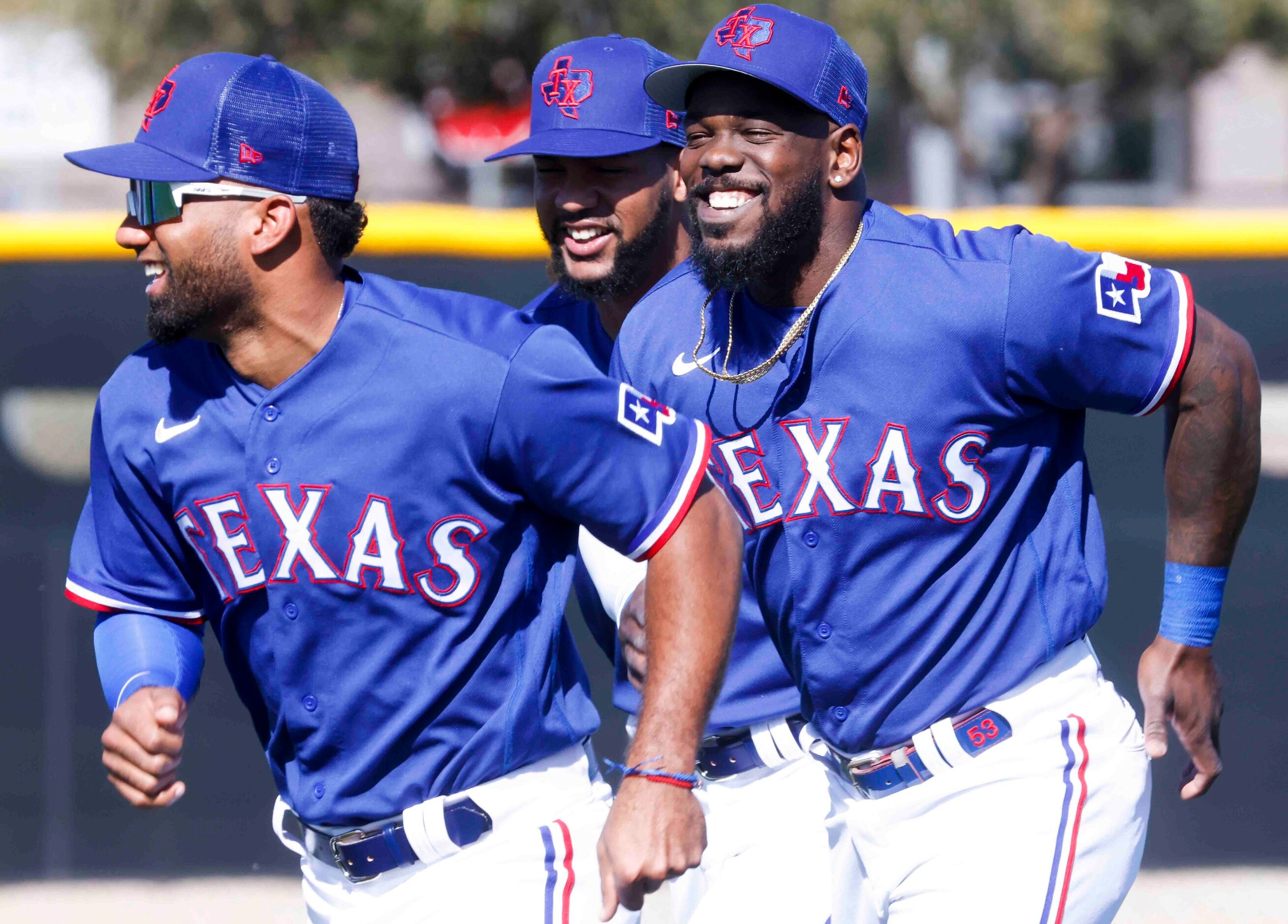 Texas Rangers infielder Ezequiel Durán, left, outfielders Leody Taveras, center, and Adolis...