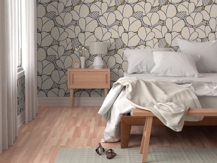 Bedroom with abstract floral wallpaper on the wall, with white curtains and a neutral bed