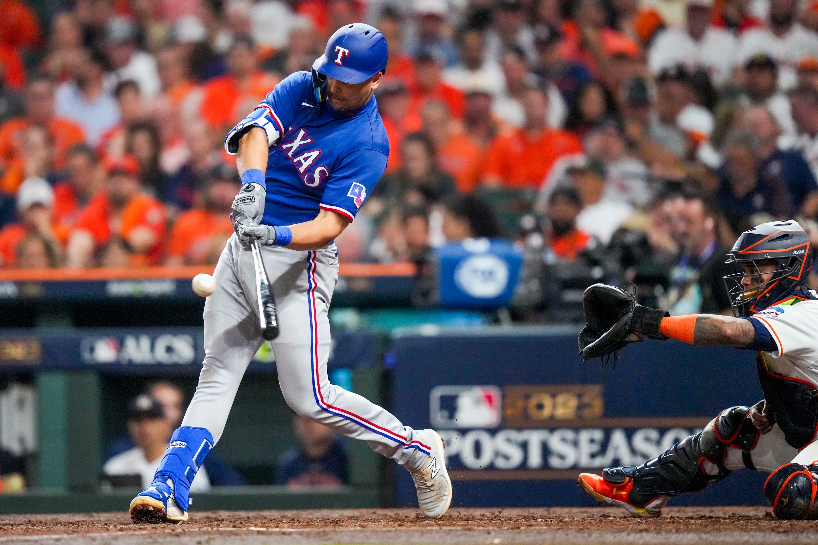 Texas Rangers first baseman Nathaniel Lowe  hits a two run home run against the Houston...