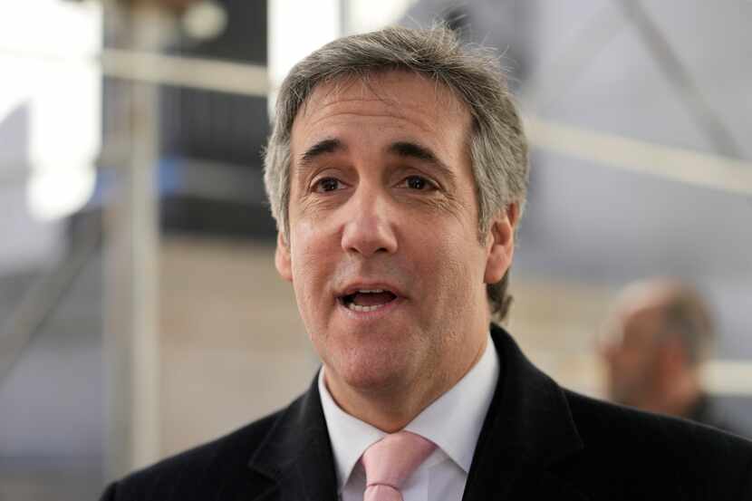 Donald Trump's former lawyer and fixer Michael Cohen speaks to reporters after a second day...