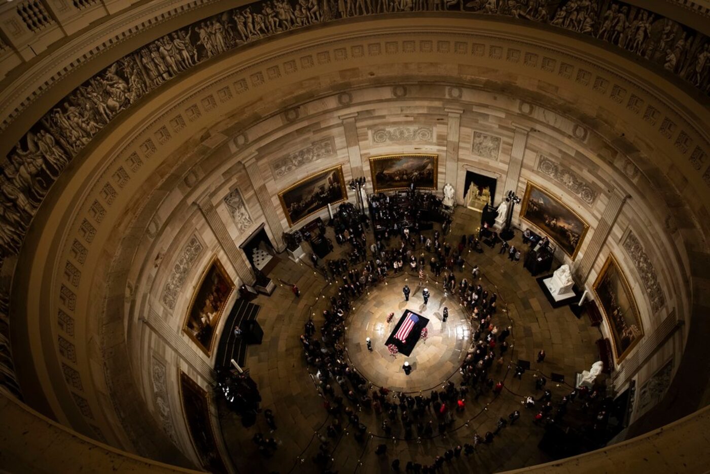 Public visitors pass by the flag-draped casket of President George H.W. Bush  in the Rotunda...