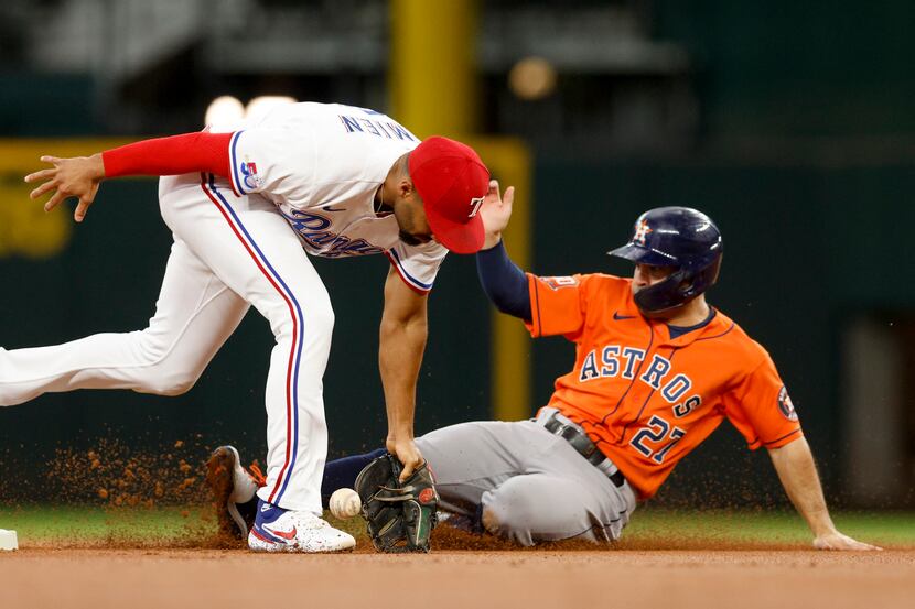 Houston Astros second baseman Jose Altuve (27) safely steals second base as Texas Rangers...