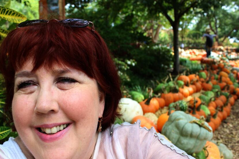 Joy Tipping takes a selfie in the Pumpkin Village at the Autumn at the Arboretum event,...