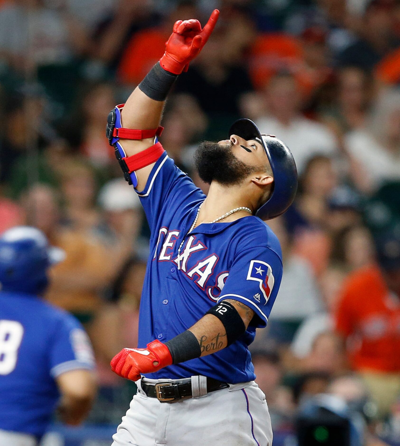 HOUSTON, TEXAS - JULY 19: Rougned Odor #12 of the Texas Rangers celebrates his sixth inning...