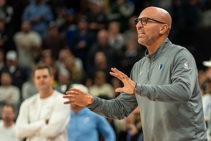 Dallas Mavericks head coach Jason Kidd tries to settle his players down during the second...