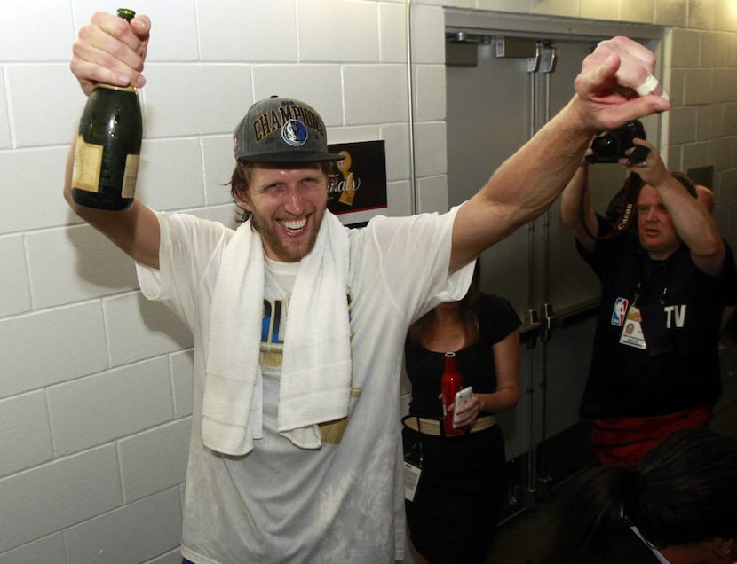 Dallas Maverick forward Dirk Nowitzki celebrates after they won Game 6 of the NBA Finals at...