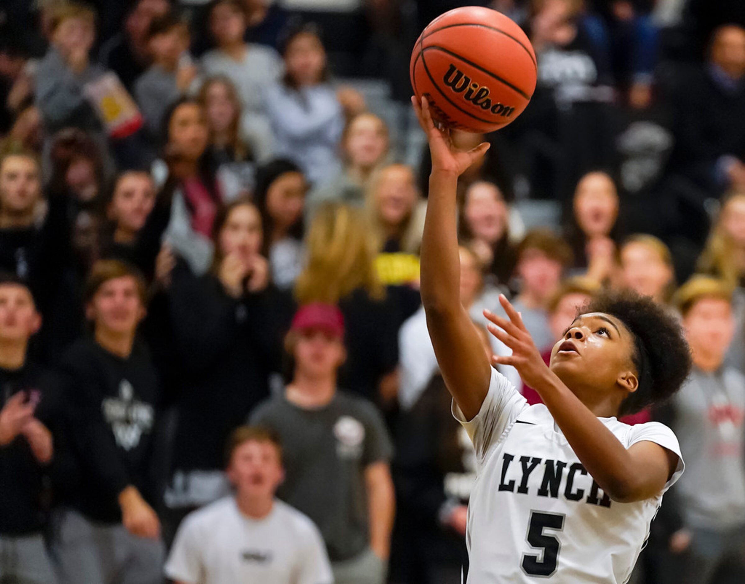 Bishop Lynch guard Maddie Cockrell (5) drives to the basket during a TAPPS 2-6A high school...