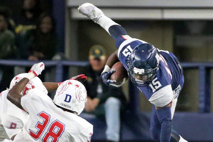 Allen running back Brock Sturges (15) goes airborne in the fourth quarter as Duncanville's...