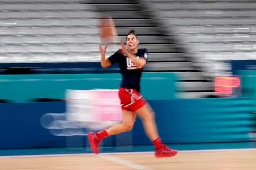 Kelsey Plum, of the Unites States, takes a pass during women's basketball practice at the...