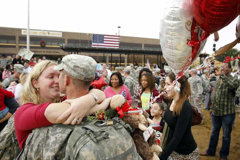 
Husband and wife Jennifer Powell and Spc Brian Powell reunite in Fort Hood after he...