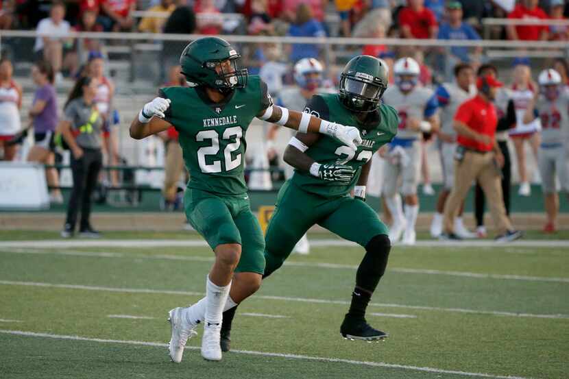 Kennedale's JD Coffey (22) celebrates his interception against Midlothian Heritage with...