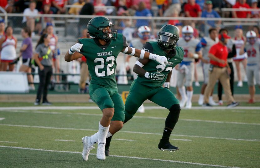 Kennedale's JD Coffey (22) celebrates his interception against Midlothian Heritage with...