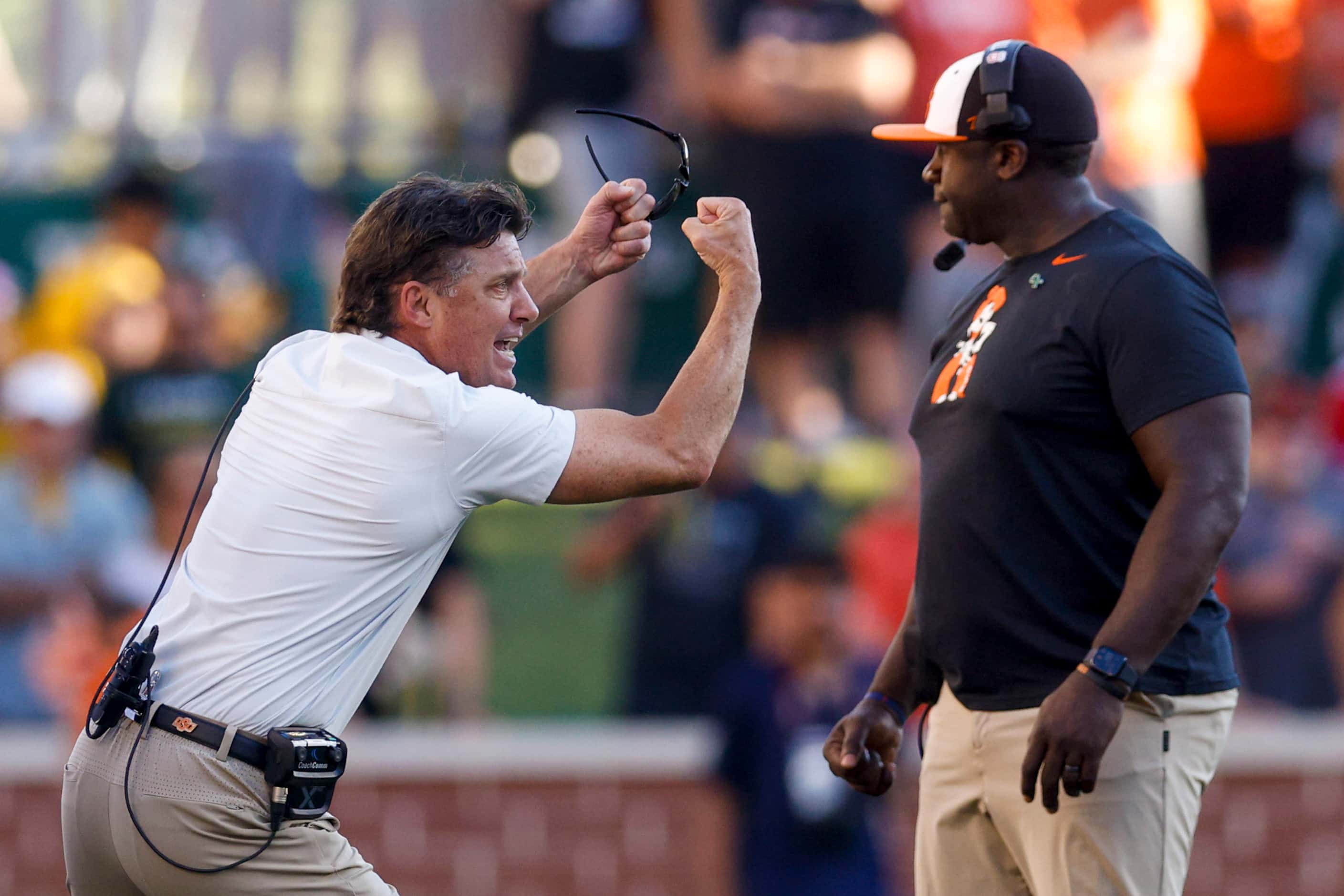 Oklahoma State head coach Mike Gundy argues for a penalty during the second half against the...