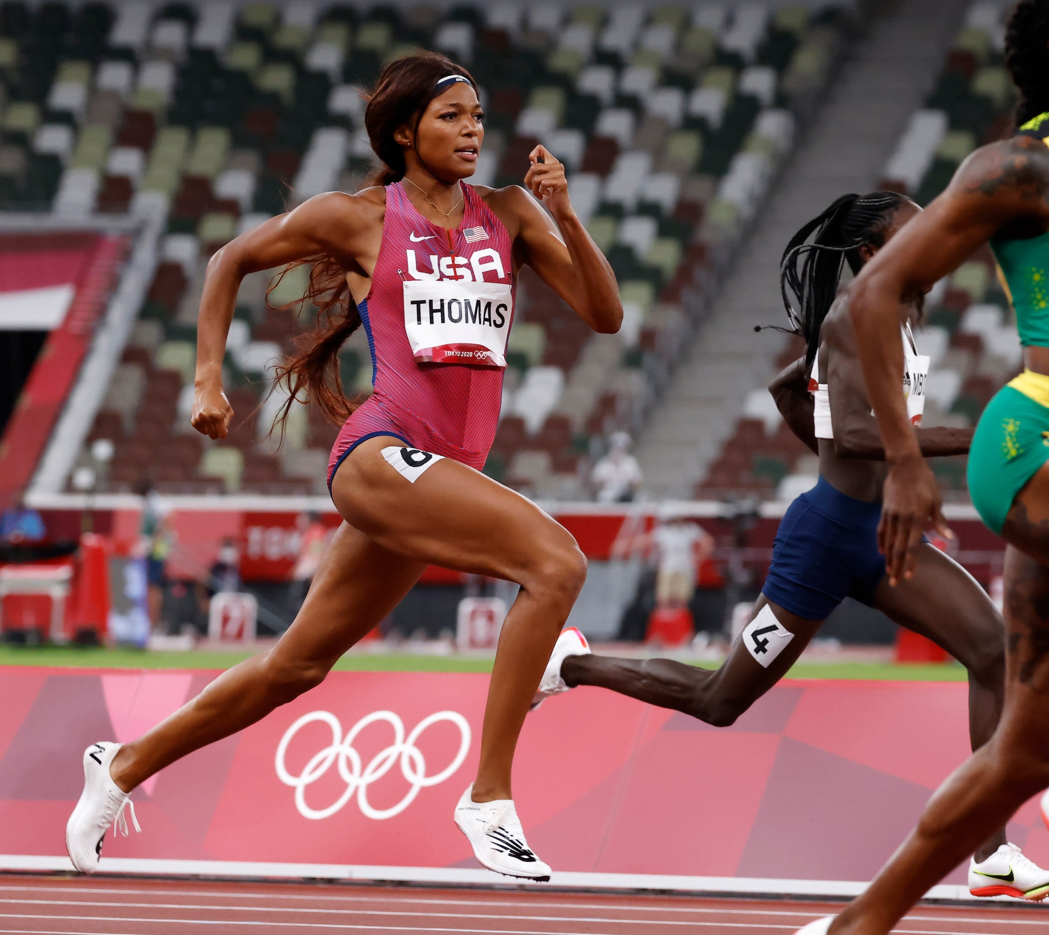 USA’s Gabrielle Thomas competes in the women’s 200 meter semifinal during the postponed 2020...