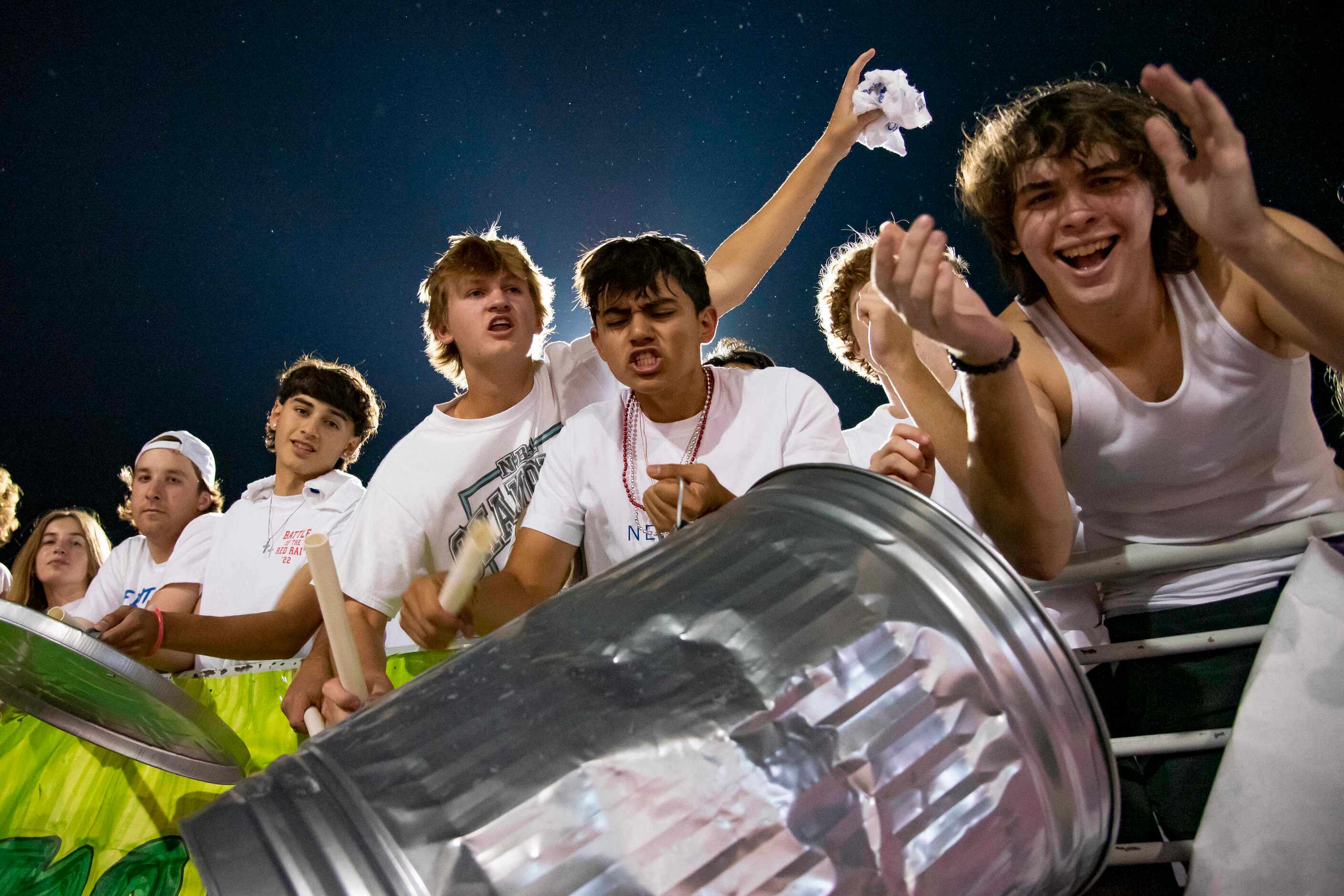 Members of the Grapevine student section bash a trash can after the Mustangs convert on a...