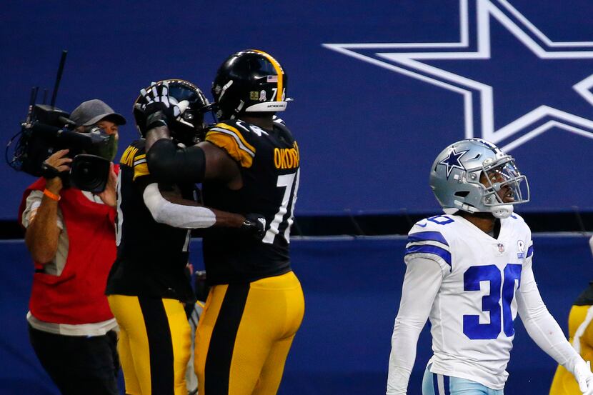 Dallas Cowboys cornerback Anthony Brown (30) looks at the video replay after being scored on...