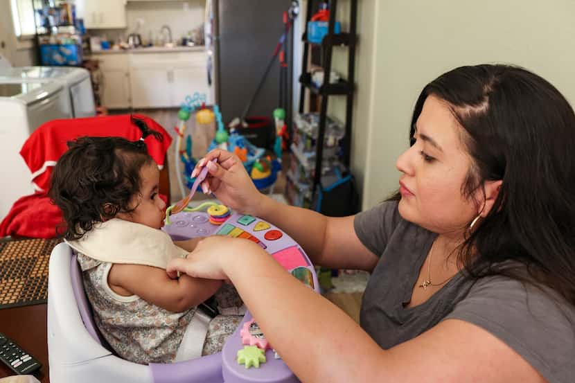 Jennifer Mendez feeds her six-month-old daughter Selena on Monday, May 16, 2022 at their...
