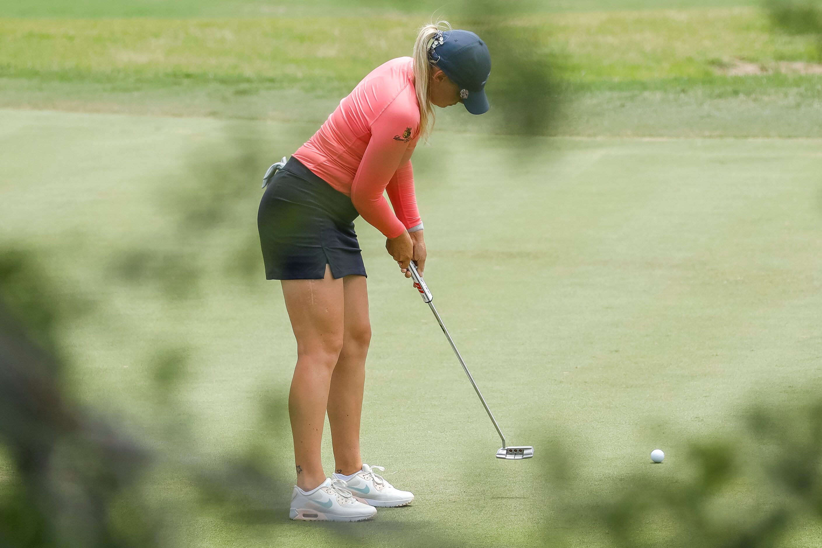 Professional golfer Matilda Castren putts a ball on the No. 1 green during the final round...