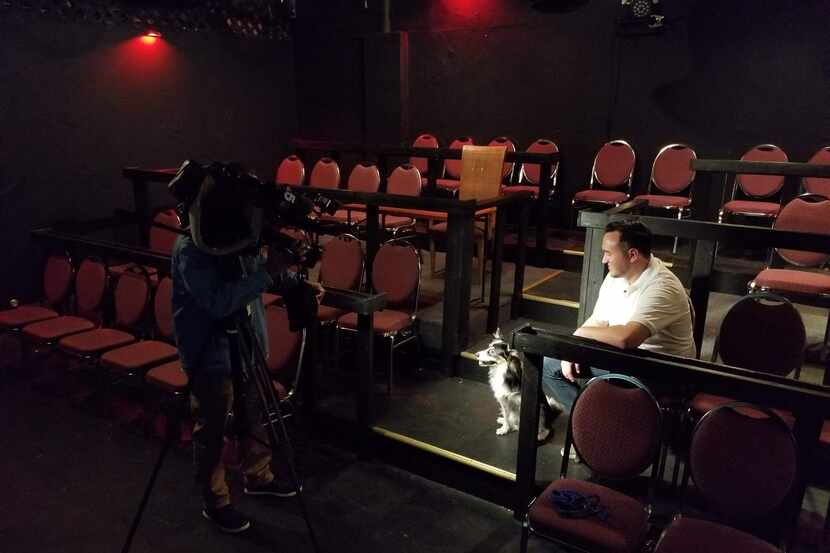 K9 Cinemas founder Eric Lankford and his dog, Bear, inside the dog-friendly movie theater....