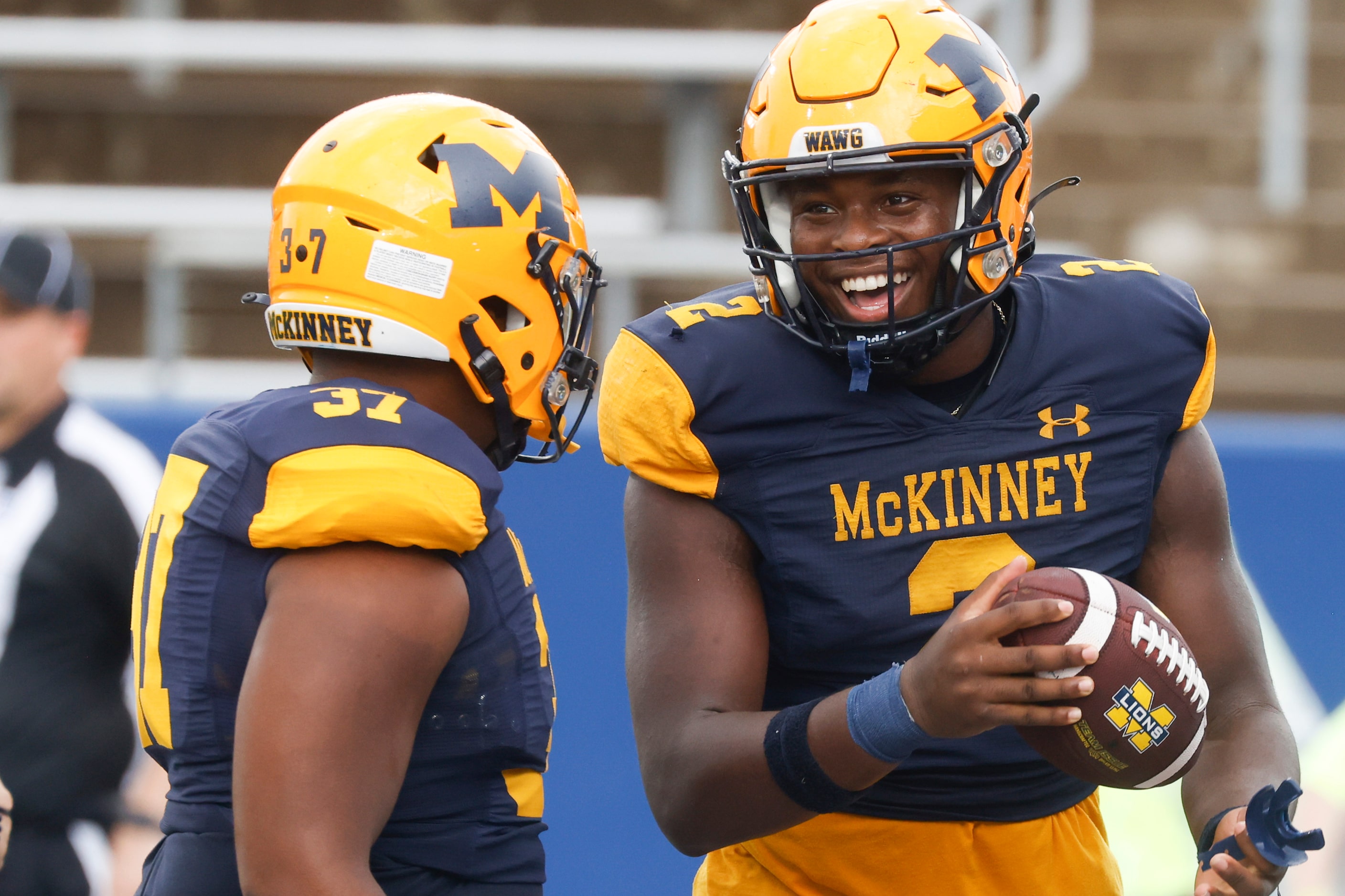 McKinney High’s Bryan Jackson (2), right, and Wyndham Thompson celebrates a touchdown...