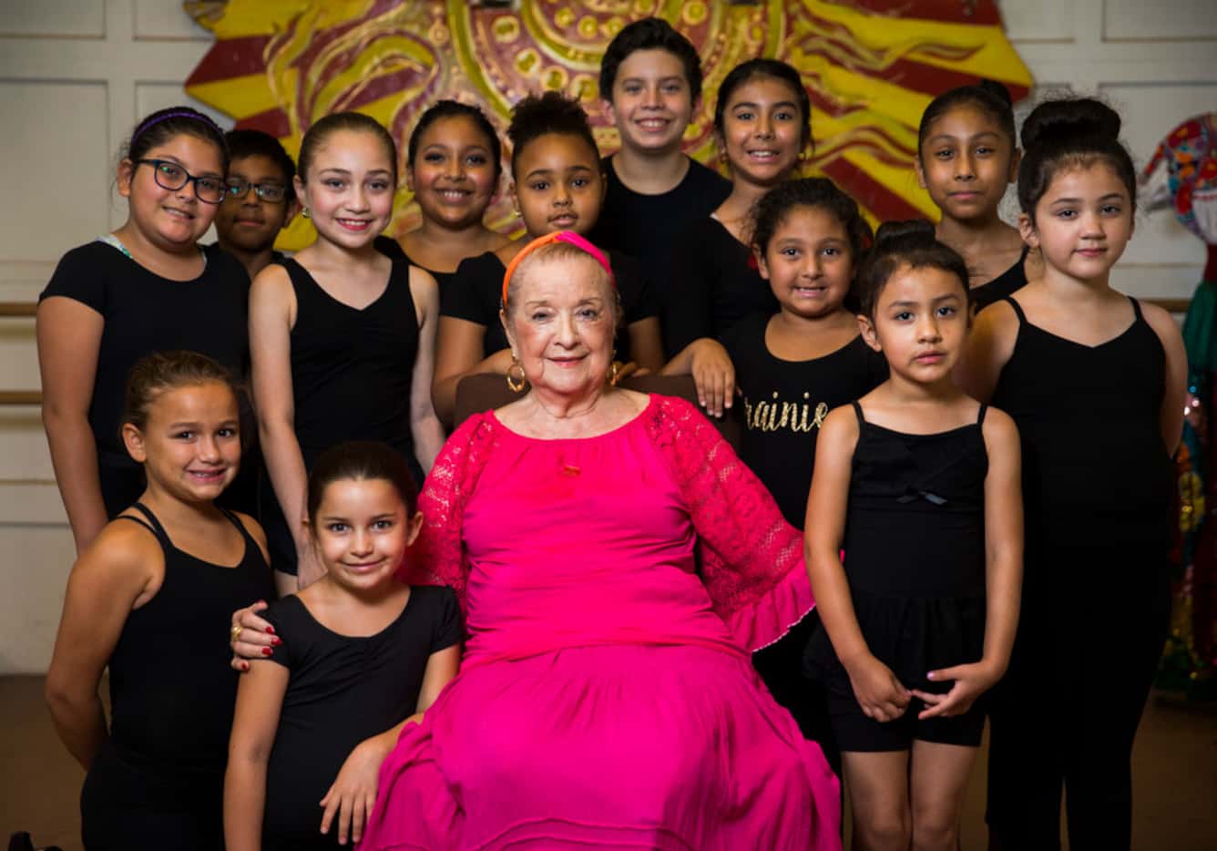 Anita N. Martinez poses for a photo with students at her ballet folklorico studio on Aug....