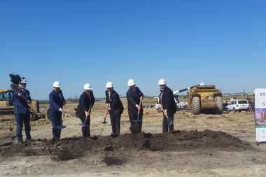  Officials breaking ground on the new hotel and convention center.