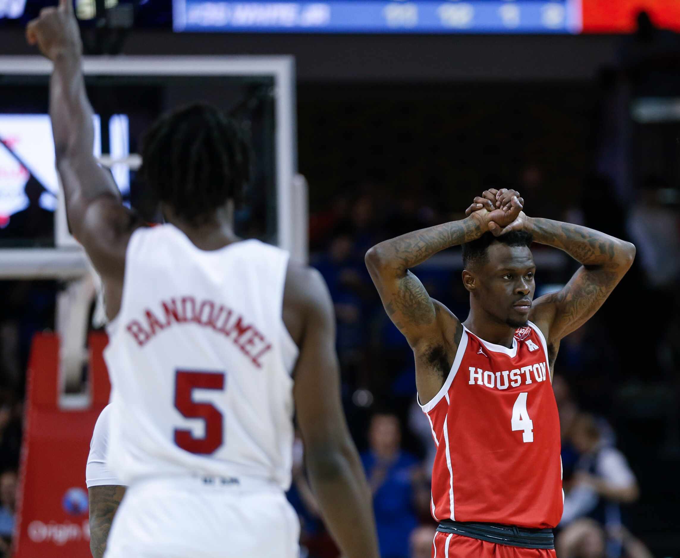 Houston Cougars guard Taze Moore (4) reacts to a call made giving possession of the ball to...