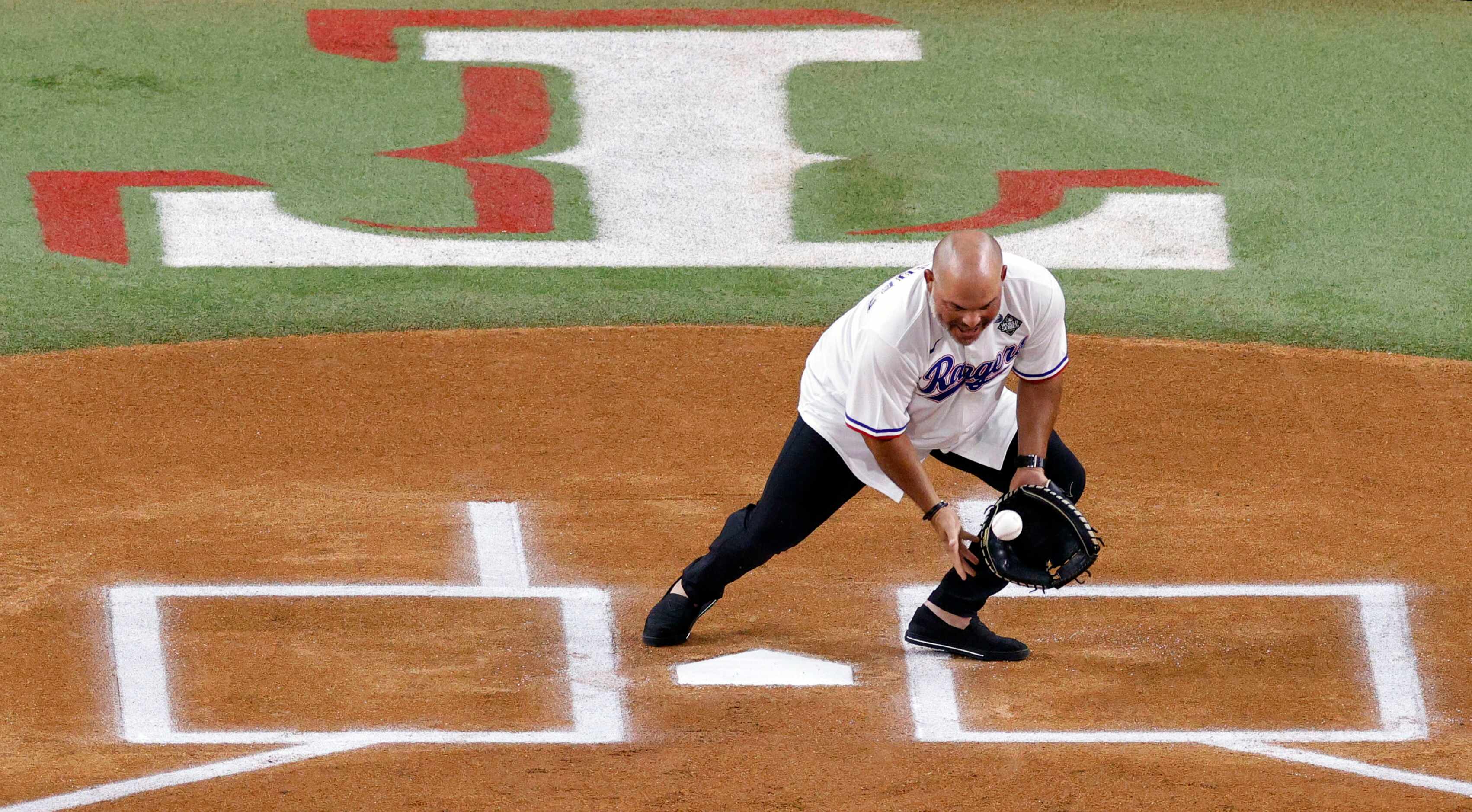 Rangers Legend and Baseball Hall of Famer Iván “Pudge” Rodríguez catches a ball during the...