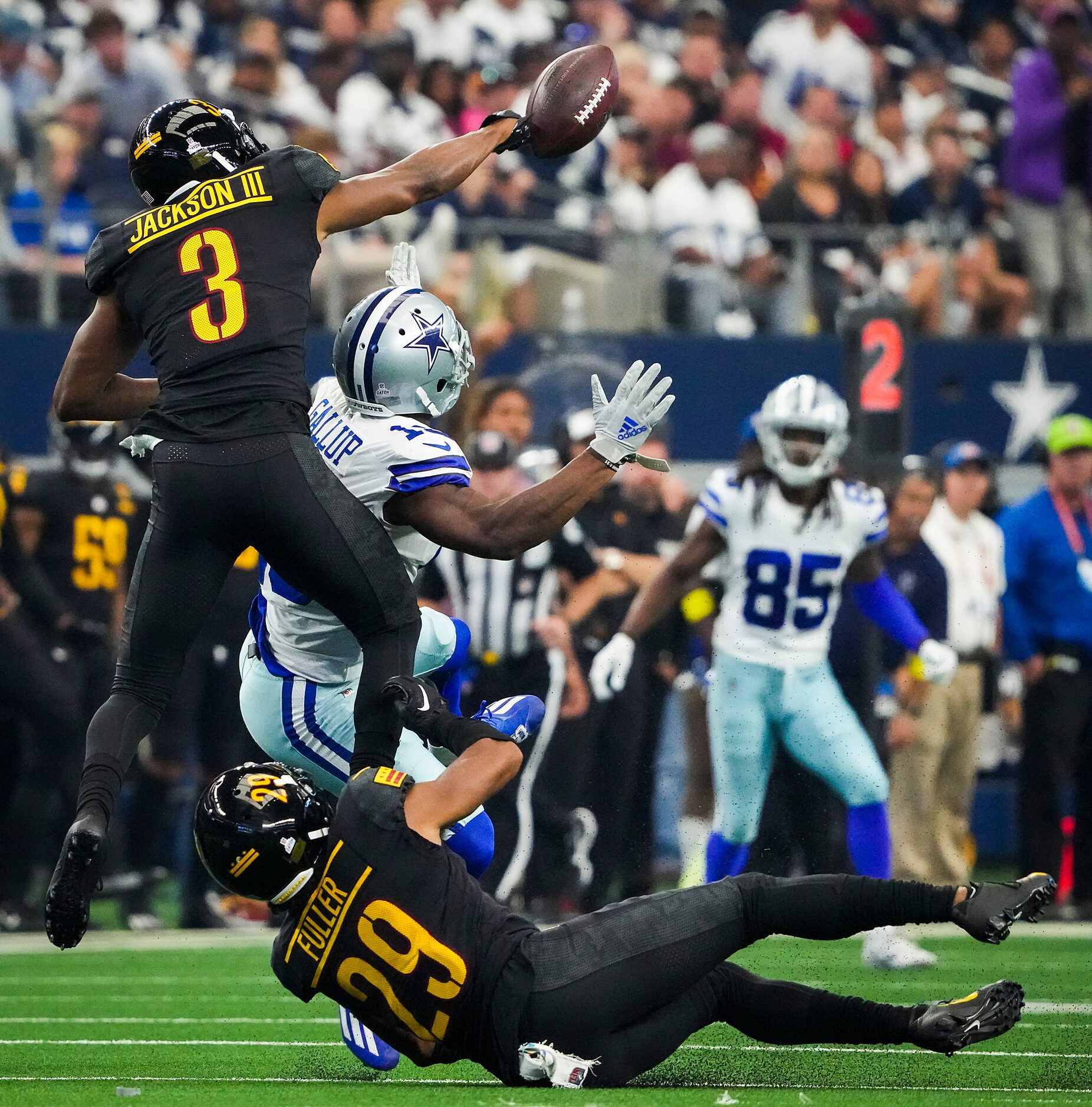 Washington Commanders cornerback William Jackson III (3) commits a pass interference penalty...