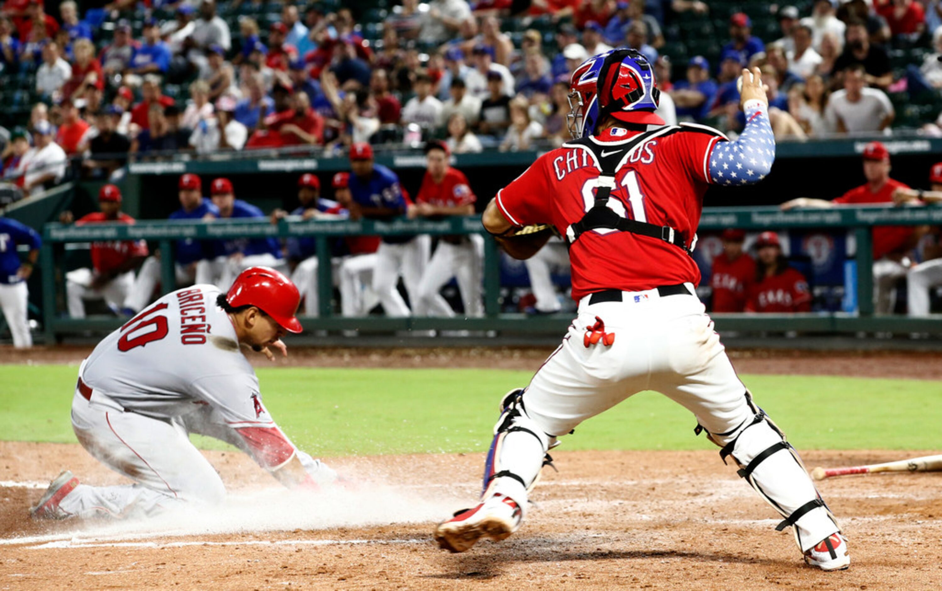 Los Angeles Angels Jose Briceno (10) is safe as he slides into home plate as Texas Rangers...