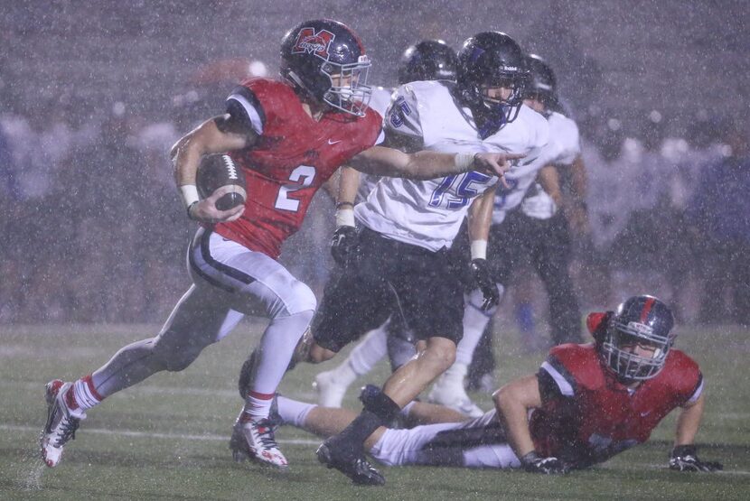 McKinney Boyd wide receiver Brandon Bowling (2) runs with the ball as rain falls in the...