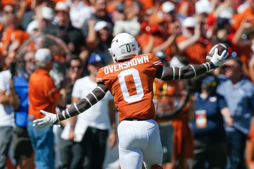 Texas linebacker DeMarvion Overshown (0) celebrates recovering a fumble by Oklahoma...