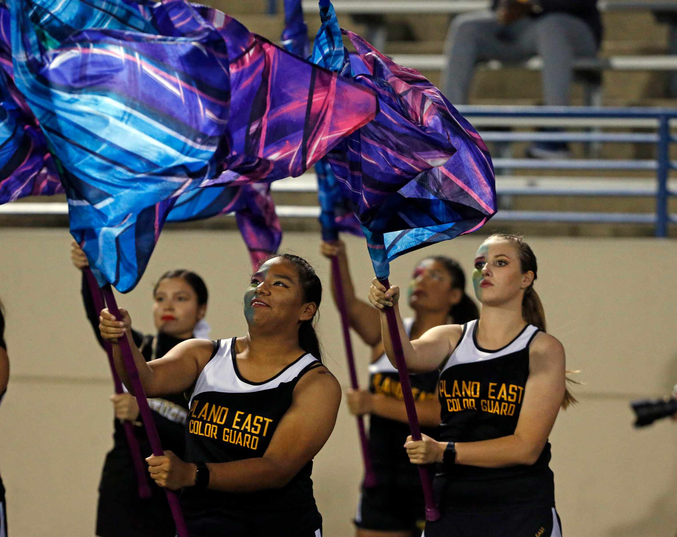 The Plano East high flag team performs on the sideline before the first half of a high...