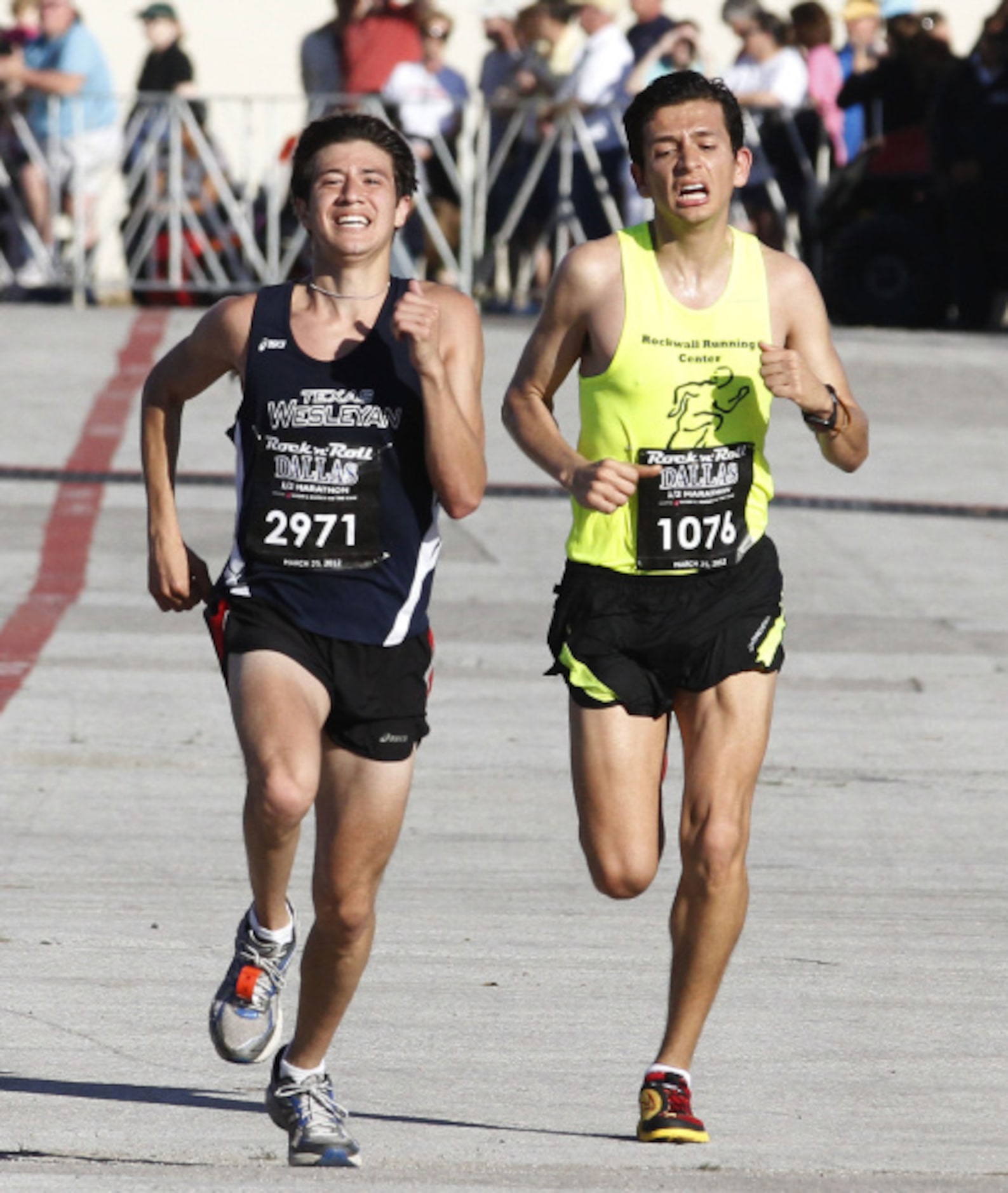 Robert Hawes of Ft. Worth (left) smiles as he passes Jose Lopez as they enter Fair Park...