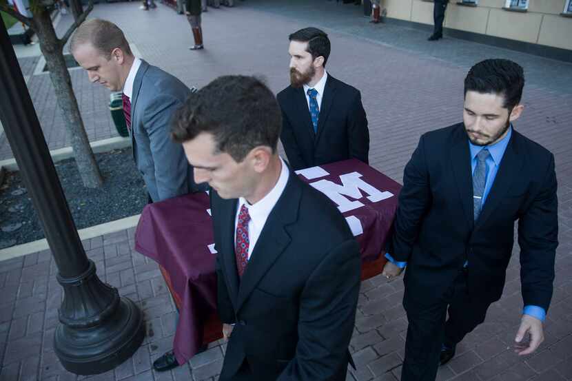 Former handlers of Reveille VIII Daylon Most (left to right), Parker Smith, Ben Coffman and...