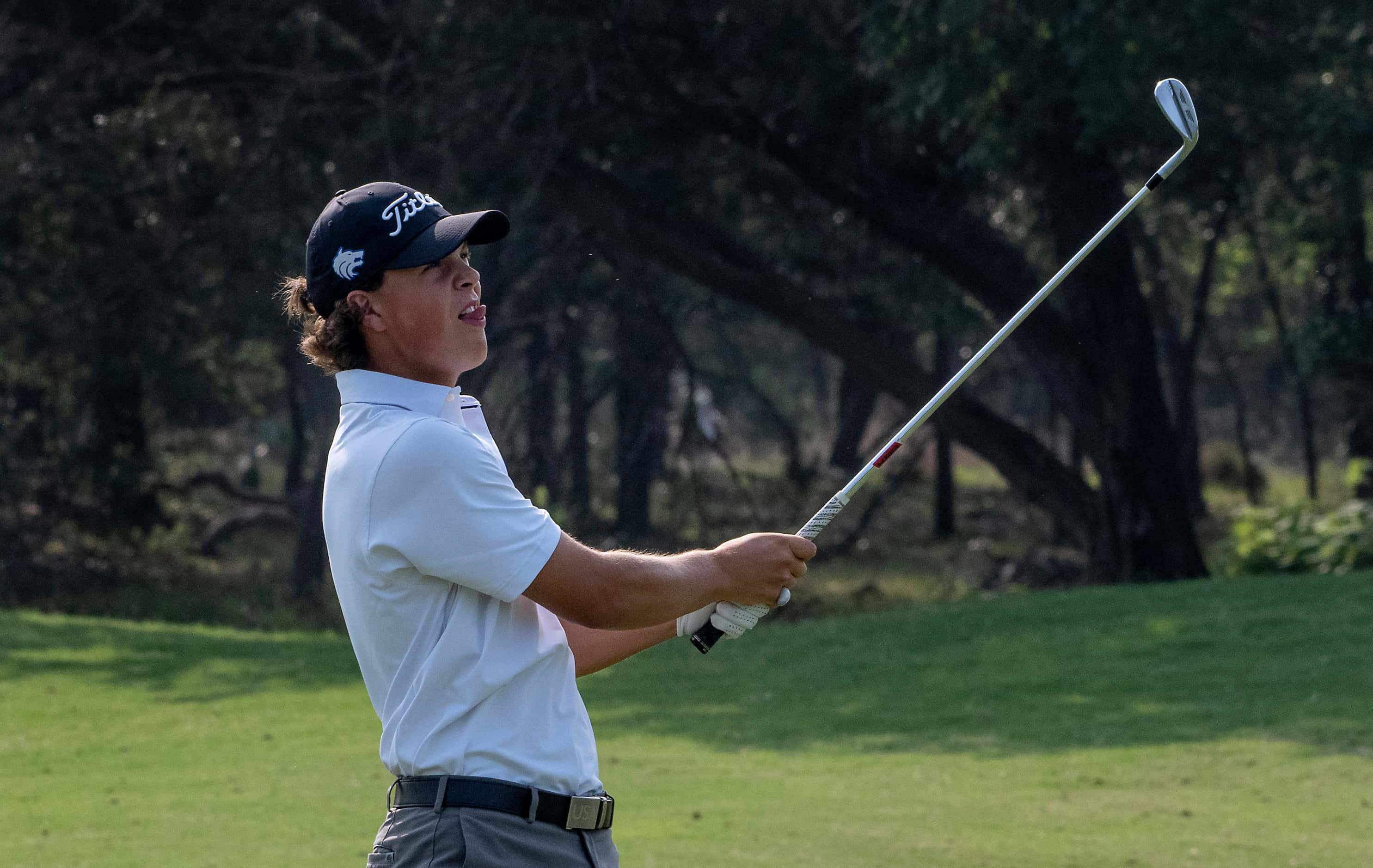 Plano West, Matt Comegys watches his fairway shot from the no.1 fairway land a few feet from...