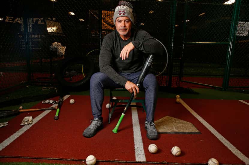 Former Texas Ranger Rafael Palmeiro poses for a portrait at D-BAT DFW batting cage in...