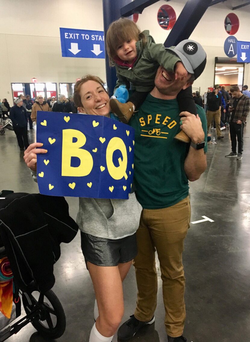 Brandi, Travis and Adaline Swicegood celebrating her Boston-qualifying finish time at the...