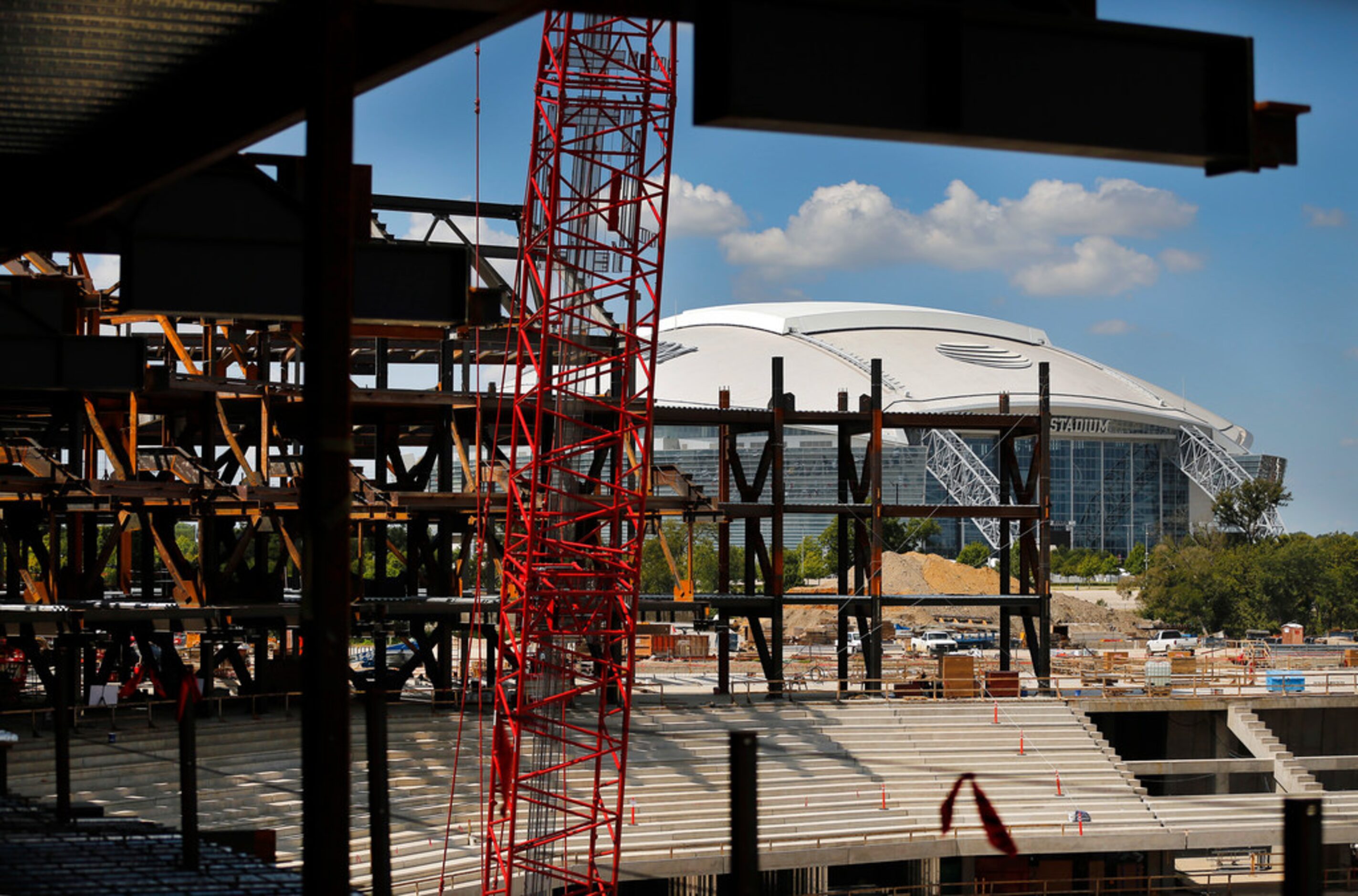 AT&T Stadium is seen behind the new Globe Life Field under construction in Arlington, Texas,...