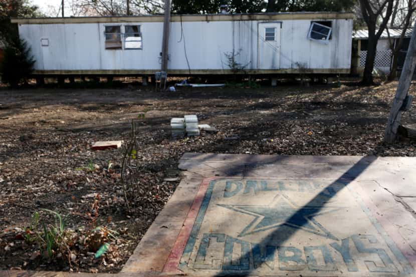 Dallas Cowboys memorabilia lay abandoned at Dallas West Mobile Home/RV Park on the day after...