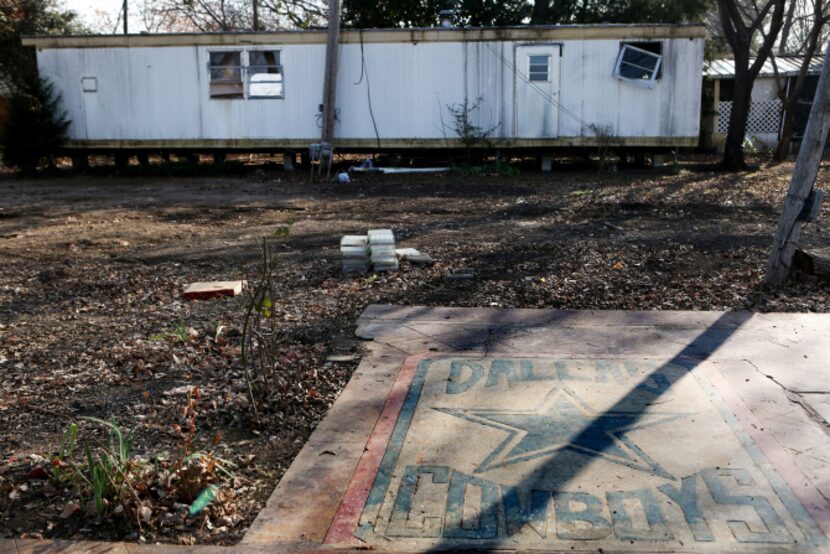 Dallas Cowboys memorabilia lay abandoned at Dallas West Mobile Home/RV Park on the day after...