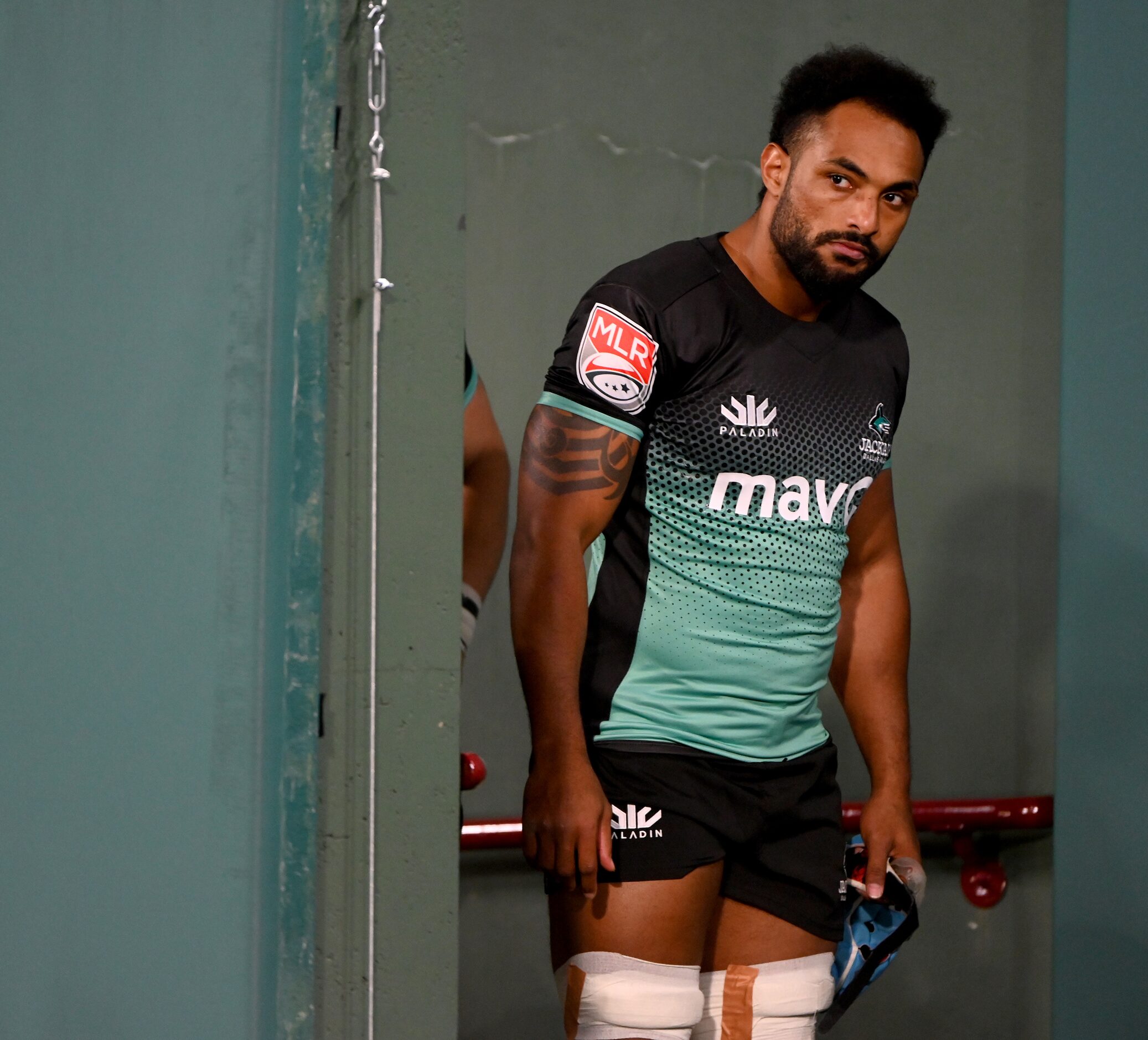 Dallas’ Mohamed Abdelmonem looks around the corner before the team is introduced before a...