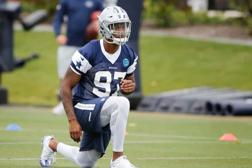 Dallas Cowboys Taco Charlton (97) stretches during rookie minicamp at The Star in Frisco on...