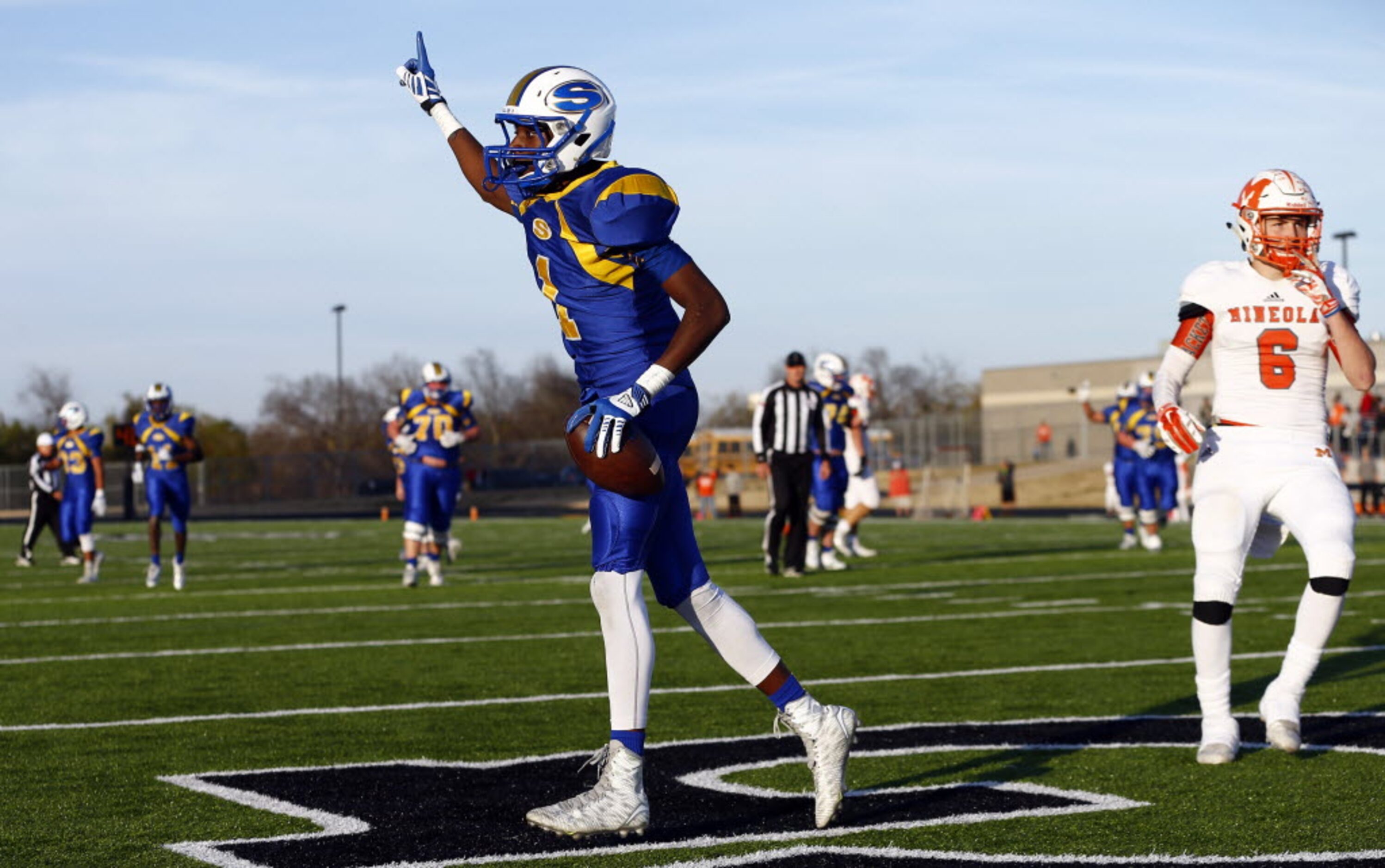 TXHSFB Sunnyvale's Chima Enyinna (1) celebrates his touchdown catch as Mineola's Noah Sneed...