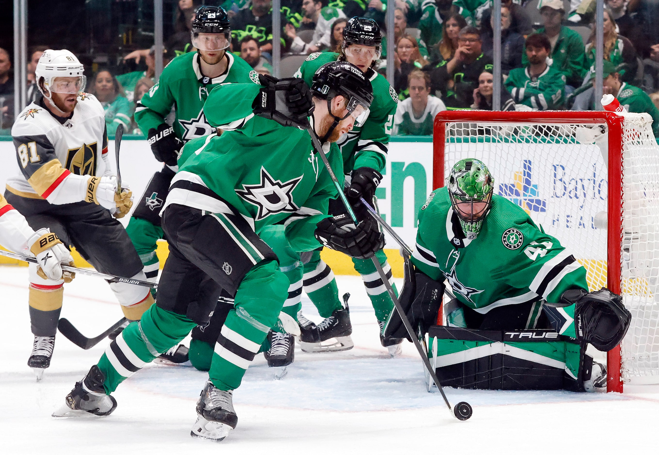 Dallas Stars center Radek Faksa (12) clears the puck away from goaltender Scott Wedgewood...