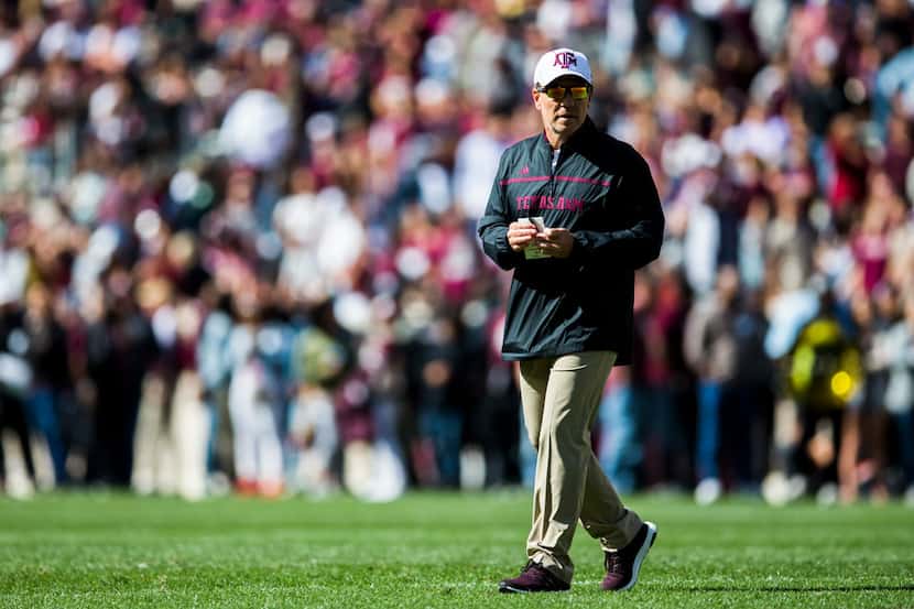 Texas A&M Aggies head coach Jimbo Fisher stands on the field during a Texas A&M University...