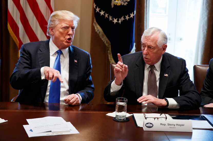 President Donald Trump speaks with Rep. Steny Hoyer, D-Md., during a meeting with lawmakers...