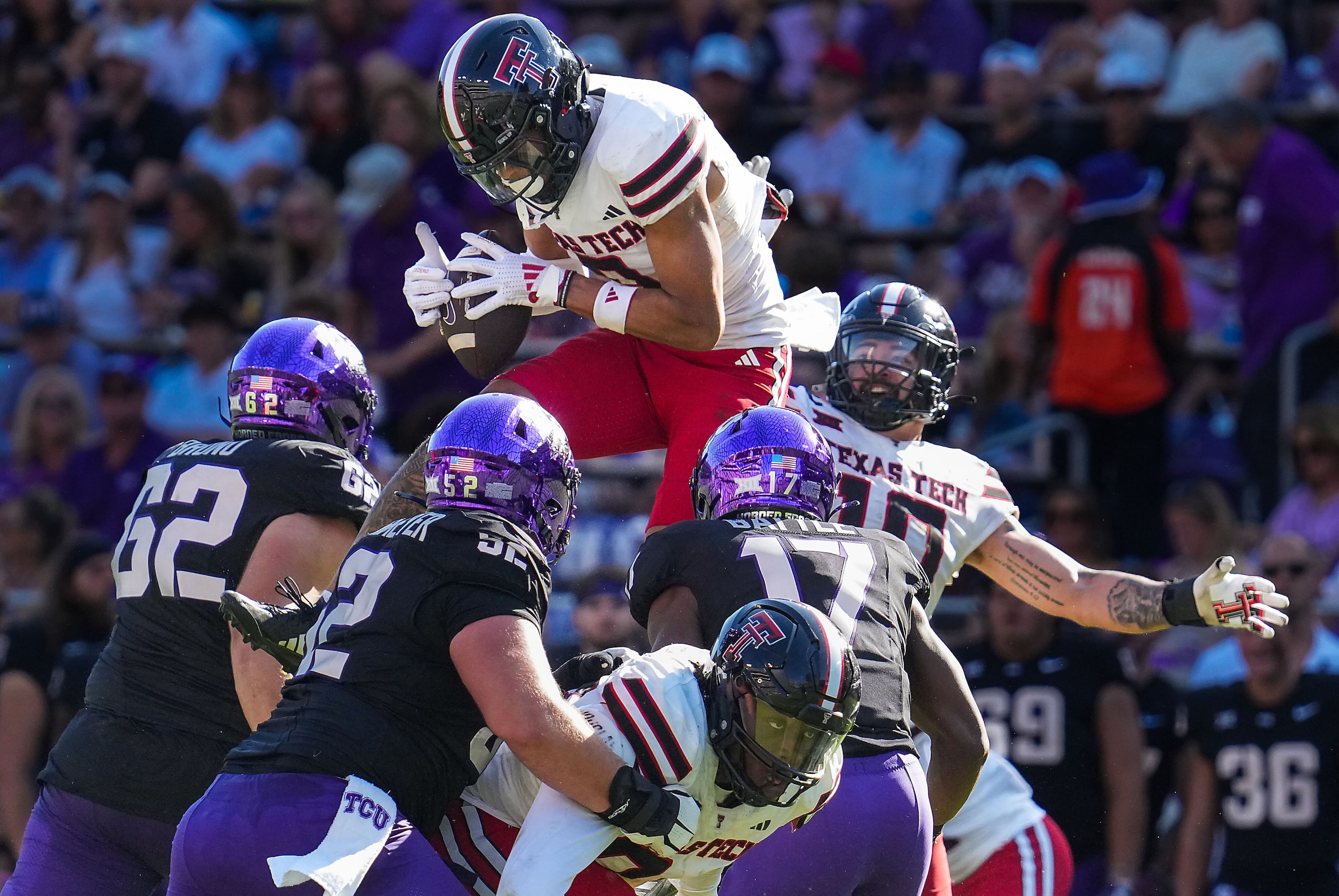 Texas Tech defensive back C.J. Baskerville (9) intercepts a pass by TCU quarterback Josh...